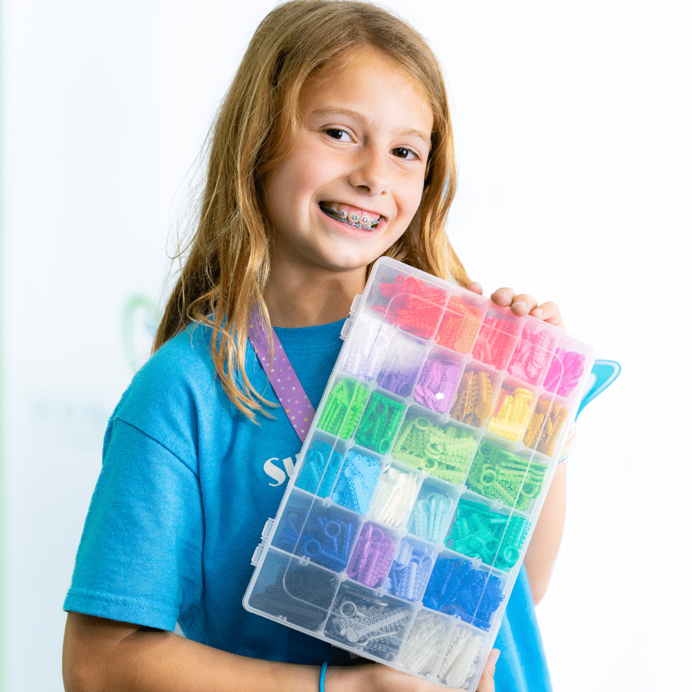 Little girl smiling with braces and braces color options